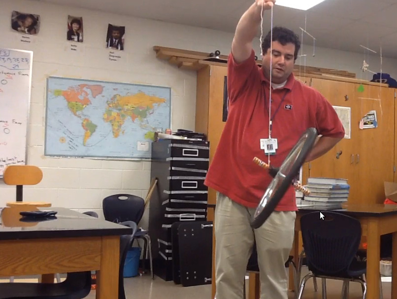 Mr. Dowd demonstrating rotational impulse
